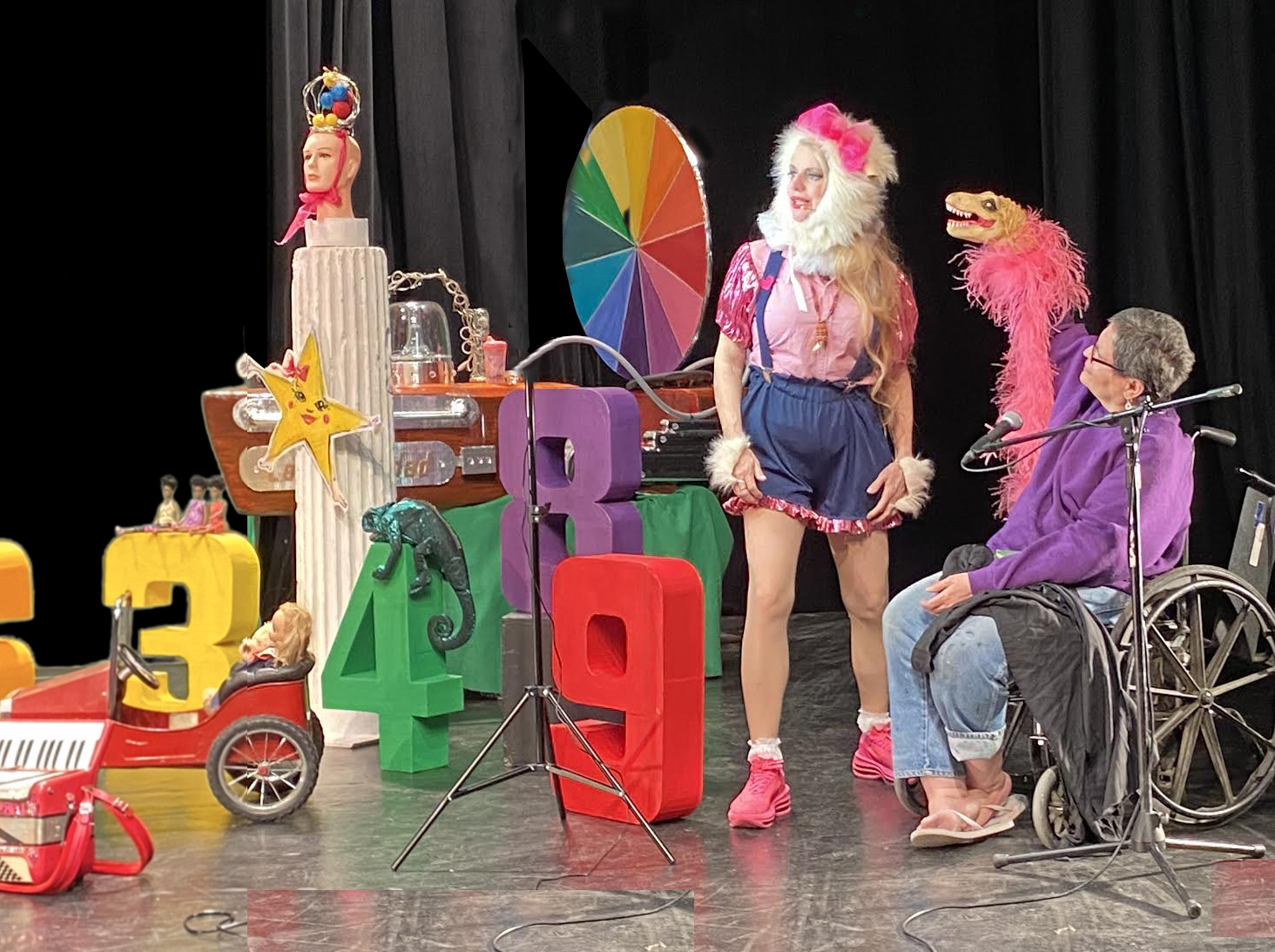 Bambi Bernstein, a small furry animal aka PHoebe Legere and Lytza Colon playing La Glamorosa, our fabulous dinosaur puppet in the Color Wheel set.