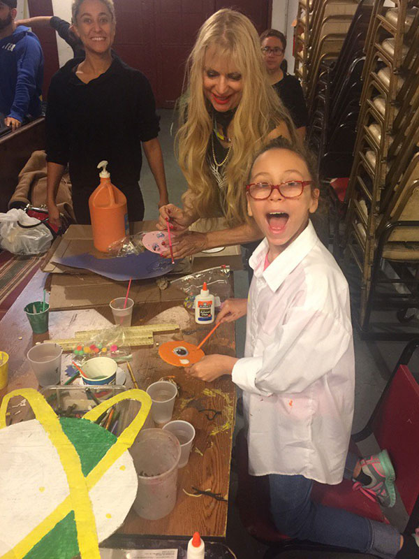 Phoebe and Danielle painting with student